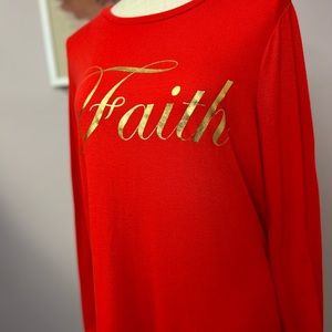 Women’s red/ orange sweatshirt with the word Faith on it in gold. No flaws.